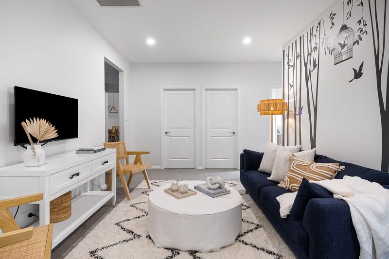 Bright living room with freshly painted white walls
