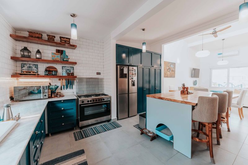Kitchen with newly painted blue cabinets